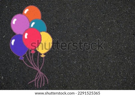 Balloon in Doodle Chalk Drawing Style on the Asphalt Sidewalk, Suitable for Childhood Backdrop Concept and Background. Royalty-Free Stock Photo #2291525365