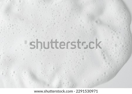Abstract background white soapy foam texture. Shampoo foam with bubbles Royalty-Free Stock Photo #2291530971