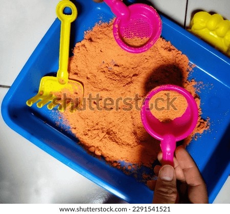 sand toys in the container photo