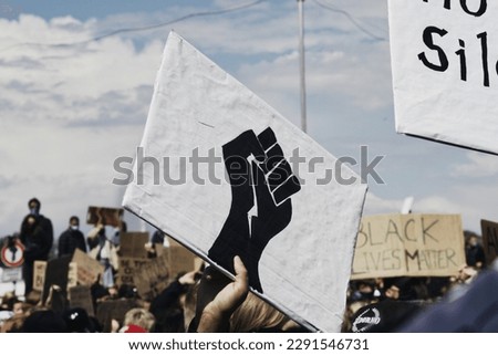 Clenched black fist sign during Black Lives Matter protest              