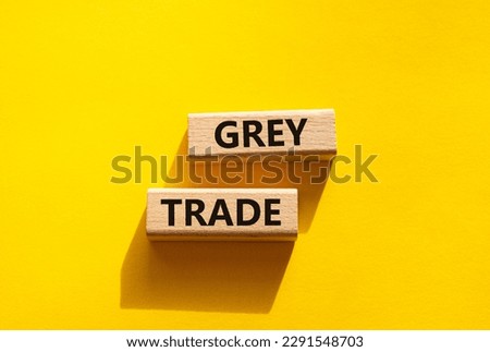 Grey trade symbol. Wooden blocks with words grey trade. Beautiful yellow background. Business and grey trade concept. Copy space.
