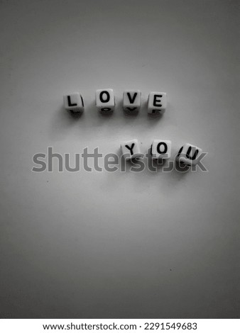 the word " love you " on a plain background with copy space