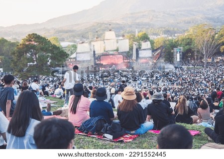 people watching concert in the park at open air,Summer festival concert. Royalty-Free Stock Photo #2291552445