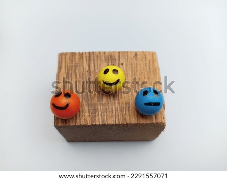 Kerala, 20  April 2023: smiles on wooden surface,the wooden surface on white background 