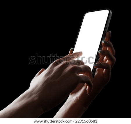 A woman's hand holds a smartphone with an empty bezel-less screen and clicks on the screen - a phone app template. 3D illustration in a dark room with subtle lighting