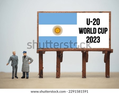 Mini toy at table with white background. U-20 FIFA World Cup 2023. Royalty-Free Stock Photo #2291581591
