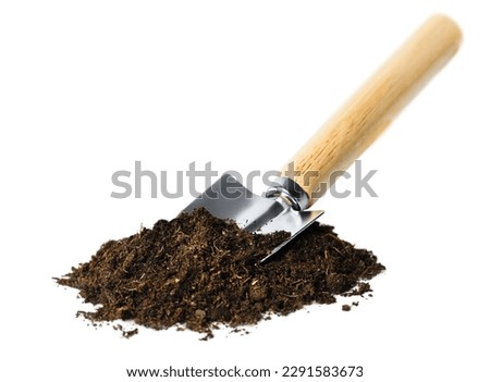 garden shovel and a pile of soil on a white isolated background Royalty-Free Stock Photo #2291583673