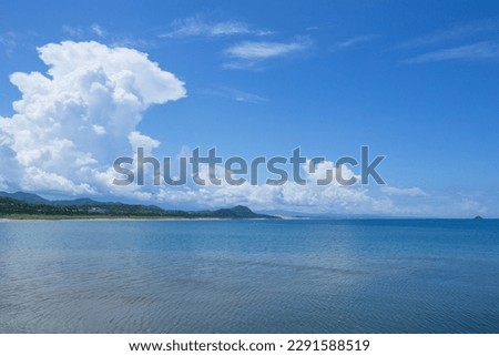 The Sea of ​​Japan in summer and a big thunderhead Royalty-Free Stock Photo #2291588519