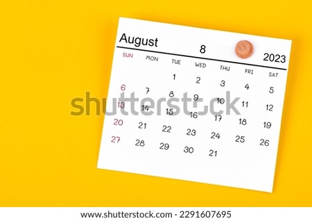 August 2023 and wooden push pin on yellow background. Royalty-Free Stock Photo #2291607695