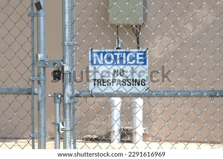 No Trespassing Sign on a Locked Gate