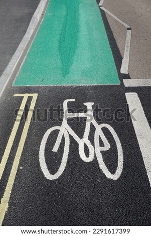 new cycle lane with painted markings on road surface. Bicycle route on city road 