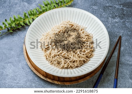 Makguksu, Korean style Buckwheat Noodles : A local specialty of Gangwon Province, Makguksu (buckwheat noodles) is made of buckwheat noodles in a kimchi soup.  Royalty-Free Stock Photo #2291618875