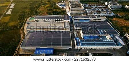 Aerial photography of solar photovoltaics on the roof of a large factory