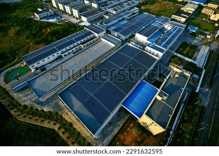 Aerial photography of solar photovoltaics on the roof of a large factory