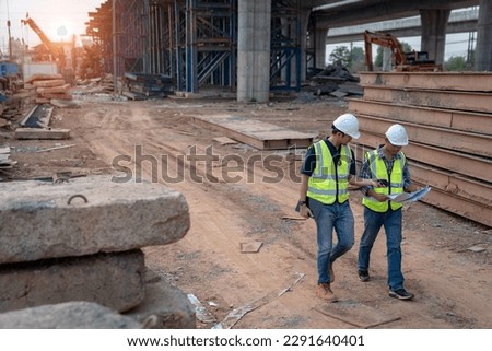 Road construction supervision team Civil engineers work at road construction sites to supervise new road construction and inspect road construction sites. Royalty-Free Stock Photo #2291640401