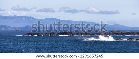 Rocky Shoreline on the West Coast of Pacific Ocean. Ucluelet, Vancouver Island, BC, Canada. Canadian Nature Background Panorama Royalty-Free Stock Photo #2291657245