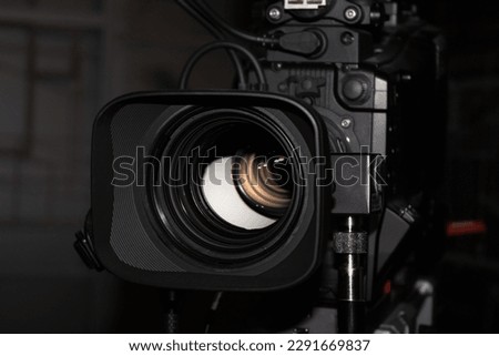One Profession Digital Motion Picture Video Camera Inside Dark Room. TV and Film Production Equipment.