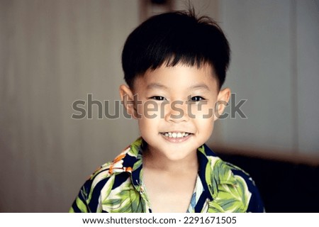 portrait of young asian boy smiling