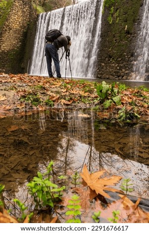 The man taking pictures at Manisa Kurşunlu Waterfall. Türkiye.