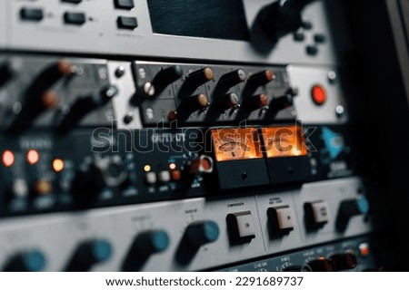 old displays of professional analog vu meters in recording studio measuring and showing decibels