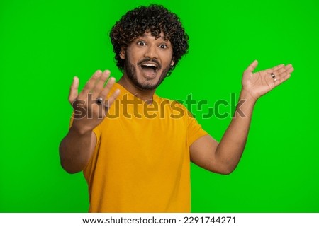 Come here, join us. Welcome. Hindu bearded man showing inviting gesture with hands, ask to join, beckoning to coming, gesturing hello, goodbye. Handsome indian guy isolated on chroma key background Royalty-Free Stock Photo #2291744271