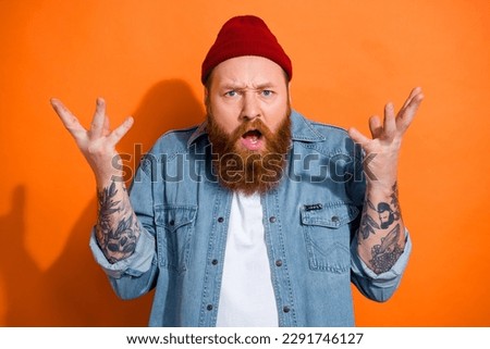 Photo of funny young man brutal unsatisfied aggressive dont like argue ask his wife where money reaction bankrupt isolated on orange color background Royalty-Free Stock Photo #2291746127