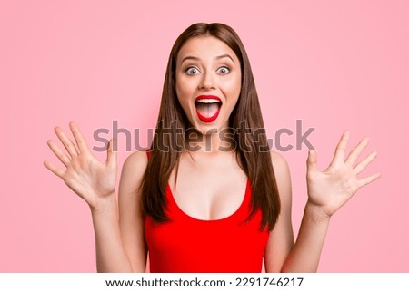 Close up portrait of amazed girl gesturing shock, extremely happy, with wide open eyes and mouth, standing on bright yellow background Royalty-Free Stock Photo #2291746217