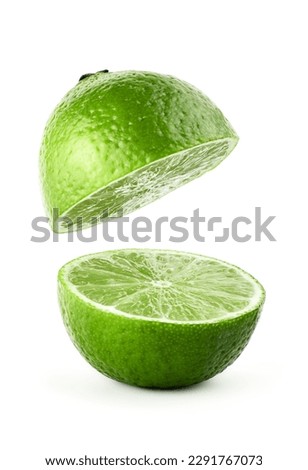Flying in air slice of lime isolated on white background. Lime with clipping path. Levitating juice lime. Half cut lime. Royalty-Free Stock Photo #2291767073