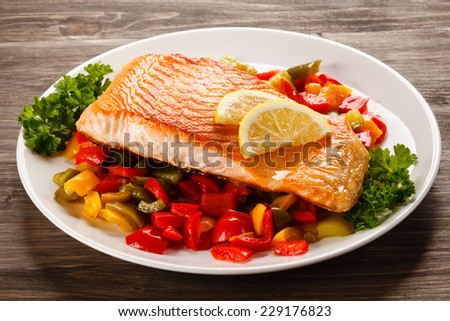 Grilled salmon and vegetables Royalty-Free Stock Photo #229176823