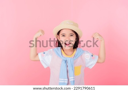 Image of Asian child posing on pink  background