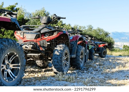 Parked ATV and UTV, mountain road. parked in a row several atv quad bikes extreme outdoor adventure concept Royalty-Free Stock Photo #2291796299