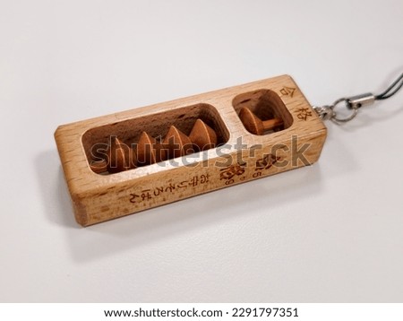 Japanese amulet in abacus form. 5 and 9 is lucky number in Japan. Translation: "Big text : Success., Small text:Abacus amulet."