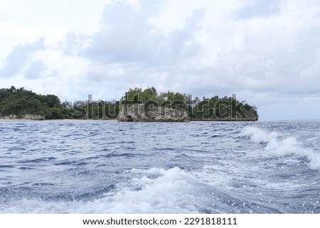 View of a small island in the middle of the sea


