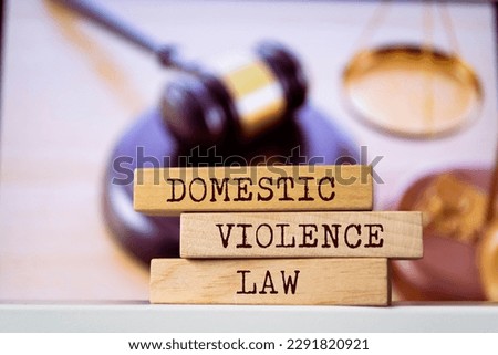 Wooden blocks with words 'Domestic violence law'. Legal concept Royalty-Free Stock Photo #2291820921