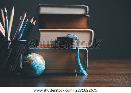 Graduation cap with Earth globe. Concept of global business study, abroad educational, Back to School. Education in Global world, Study abroad business in universities in worldwide. language study Royalty-Free Stock Photo #2291822675
