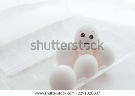 some white eggs and emoji
