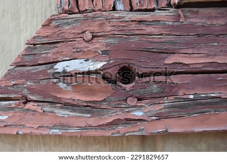 Peeling Old Red Paint on Wood Trim Vintage Texture. High quality photo