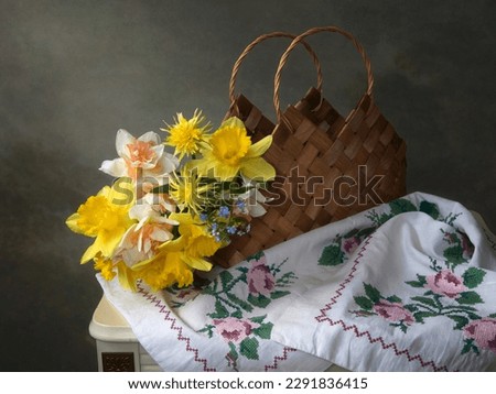Still life with bouquet of daffodils in a basket