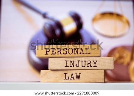 Wooden blocks with words 'Personal Injury Law'. Legal concept Royalty-Free Stock Photo #2291883009