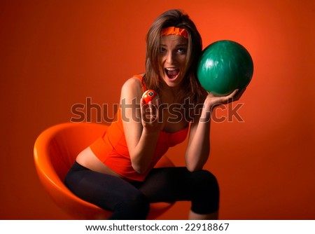 young woman holding bowling ball