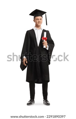 Full length portrait of a smiling male student wearing a graduation gown and holding a diploma isolated on white background Royalty-Free Stock Photo #2291890397