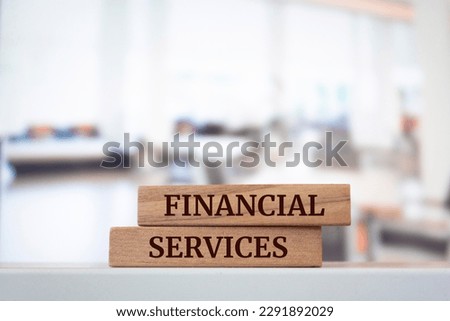 Wooden blocks with words 'FINANCIAL SERVICES'.