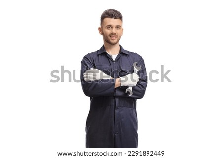 Car mechanic holding a wrench and posing isolated on white background Royalty-Free Stock Photo #2291892449