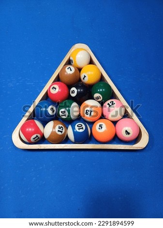 Pool billiard balls with rack on bluetable sport game set Royalty-Free Stock Photo #2291894599