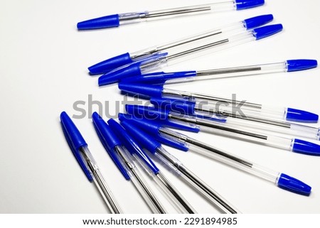 Ballpoint pens. Choice of handles. Colored pens. Ink pens for writing. The pens are on the page of the notebook. Stationery  Royalty-Free Stock Photo #2291894985