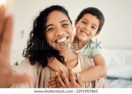 Smile, selfie and mother with child on a bed hug, love and bonding in their home together. Portrait, embrace or woman with son in bedroom waking up, happy and posing for profile picture, photo or pov Royalty-Free Stock Photo #2291907865