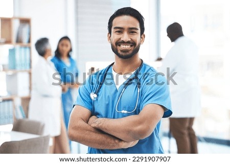 Medical, arms crossed doctor with portrait of man for healthcare, surgery and happy. Smile, medicine and confident with male nurse standing in hospital for wellness, cardiology and expert Royalty-Free Stock Photo #2291907907