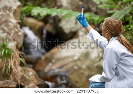 Science, nature and woman with water in test tube for inspection, environment and ecosystem study. Agriculture, biology and female scientist with sample for analysis, research and climate change Royalty-Free Stock Photo #2291907955