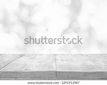 Empty white wooden surface against blurred background, bokeh effect. Space for design