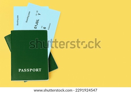 Green passports, flight boarding pass, airline tickets, airplane travel concept, passenger check in, customs control, border cross, summer holidays, vacation, international tourism banner, copy space Royalty-Free Stock Photo #2291924547